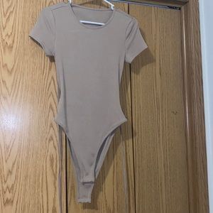 Tan Shein backless body suit. Shortsleeved